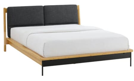 Contemporary bed frame featuring a padded upholstered headboard, wooden frame, and sleek black metal legs, ideal for a stylish and comfortable bedroom setup.