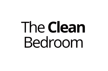 Comfortable, clean bedroom with a focus on healthy sleep environment; featuring a well-made high-quality beds and organized space. Ideal for mattress shopping and finding the best mattresses for a good night's sleep.